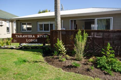 a house with a sign that reads tamarapa river lodge at Tarawera River Lodge Motel in Kawerau