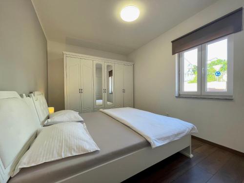Posteľ alebo postele v izbe v ubytovaní Apartments FILIP