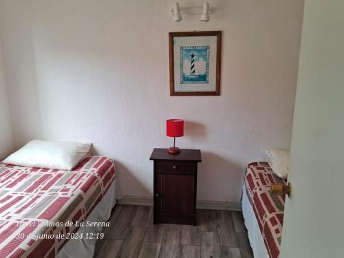 Letto o letti in una camera di Hotel Palmas de La Serena