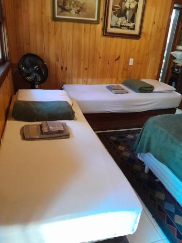 Postel nebo postele na pokoji v ubytování SITIO SIMPLESMENTE DEMAIS