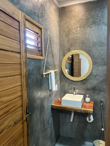 a bathroom with a sink and a mirror at Suite Sol Preazen in Prea