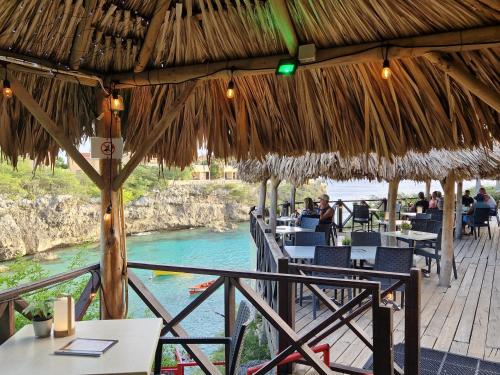 a restaurant with a view of a river at Apartment "Always SUNday", Lagoon Ocean Resort in Lagun