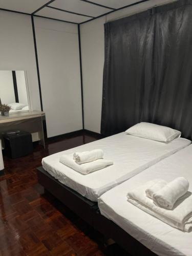 Ένα ή περισσότερα κρεβάτια σε δωμάτιο στο No5 Hostel Songkhla