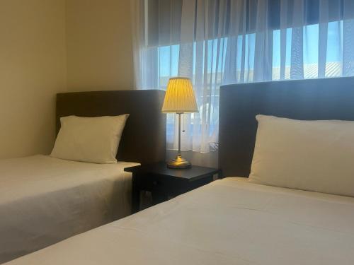 Ένα ή περισσότερα κρεβάτια σε δωμάτιο στο Comfort Inn Robe