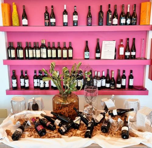a bunch of bottles of wine on a table at Hotel Bristol in Lignano Sabbiadoro