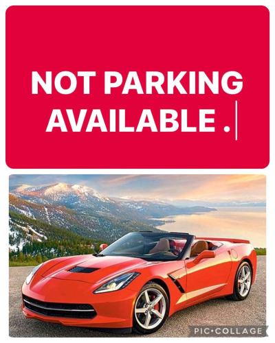 parking poster with a red car at Private Room A-KING BED-12Mints NYCity in West New York