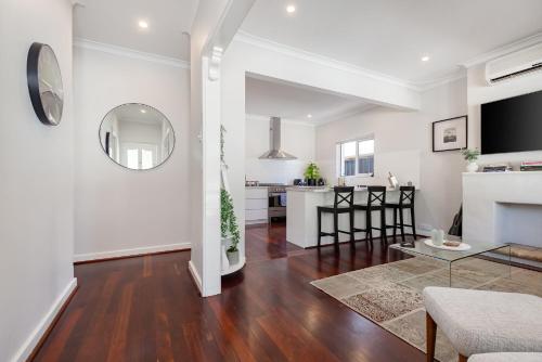 an open living room with a dining room and a kitchen at Guildford Cottage by Swan BnB Management in Perth