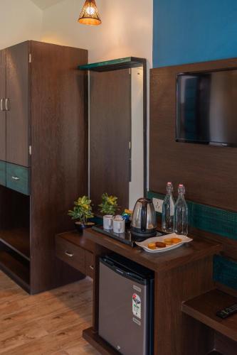 a kitchen with a counter with a plate of food on it at Tathastu Tadoba in Mohurli