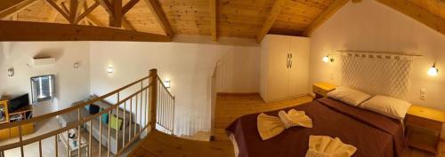 a living room with a couch and a staircase at Levanta in Kastrisiánika
