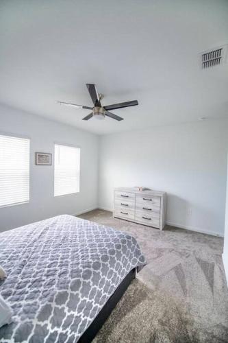 a bedroom with a bed and a ceiling fan at A Getaway Home in The Clouds in Pine Grove