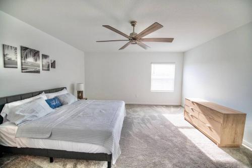 a bedroom with a bed and a ceiling fan at A Getaway Home in The Clouds in Pine Grove
