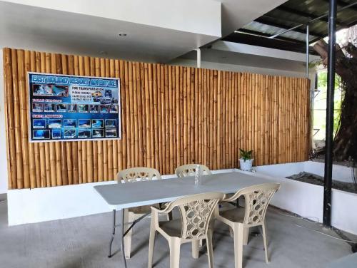 a dining room with a table and chairs at East Holiday Resort Moalboal in Moalboal