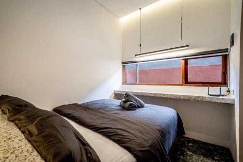 En eller flere senge i et værelse på Kumiko Apartment