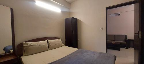Postel nebo postele na pokoji v ubytování Tranquil Serviced Apartments