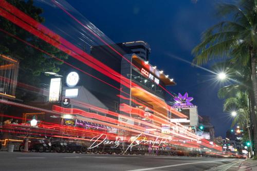 a busy city street at night with a building at Luxury Edge Seaview Apartment in Pattaya Central