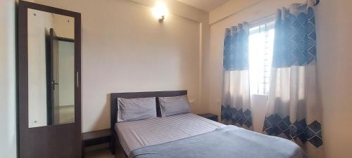 Postel nebo postele na pokoji v ubytování Tranquil Serviced Apartments