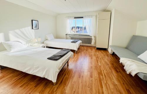 Postel nebo postele na pokoji v ubytování CozyHouse