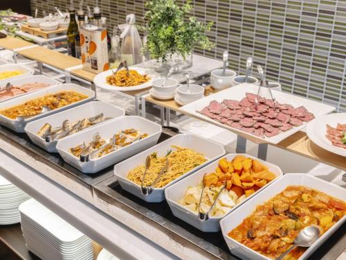 a buffet with many different types of food in trays at Akihabara Washington Hotel in Tokyo