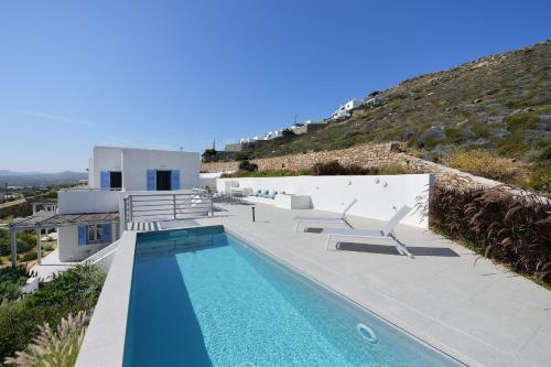 a villa with a swimming pool on a hill at Ariti's Villas 2 - Naxos in Naxos Chora
