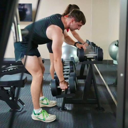 a man in a gym working out on a machine at Irene Pool Villa Resort, Koh Lipe in Ko Lipe