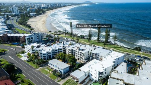 an aerial view of the beach and buildings at Alex Beachside Pet Friendly 2 Bed Apartment in Alexandra Headland