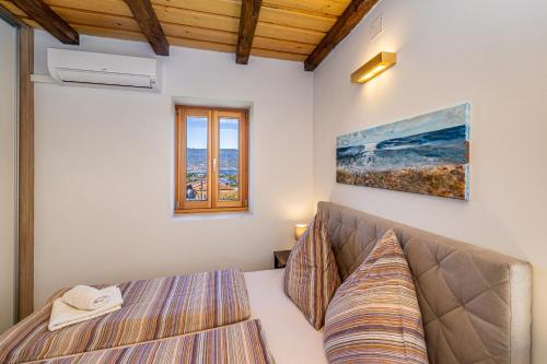 Posteľ alebo postele v izbe v ubytovaní Holiday house Villa Šilo