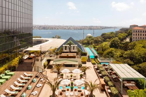 an aerial view of a hotel with a view of the water at The Ritz-Carlton, Istanbul at the Bosphorus in Istanbul