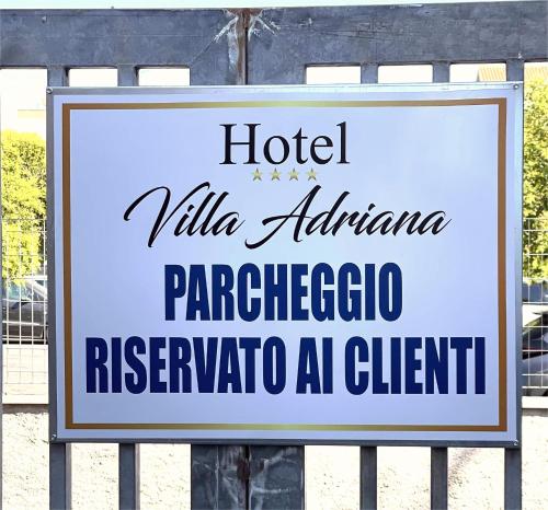 a sign for a hotel virgililla albuquerque paracetoriaregoriare at Villa Adriana Hotel in Tivoli