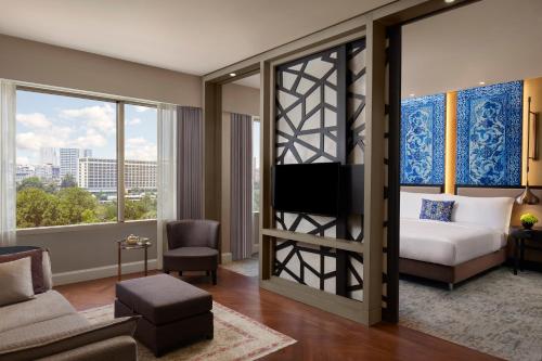 a hotel room with a bed and a large window at The Ritz-Carlton, Istanbul at the Bosphorus in Istanbul