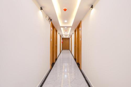a corridor of an office building with a hallway at FabHotel Crystal I - Gandhinagar in Gandhinagar