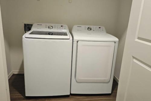two white appliances sitting next to each other in a room at Contemporary Austin Home Near Downtown & Airport in Austin