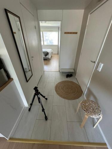 a view of a hallway with a camera and a tripod at Apartment Korkalonkatu in Rovaniemi