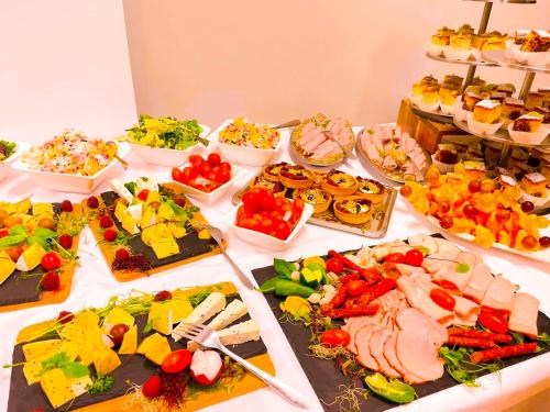 a table topped with lots of different types of food at Aqua-Zdrój in Wałbrzych