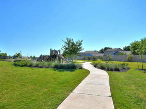 a path through a park with a playground at Contemporary Austin Home Near Downtown & Airport in Austin