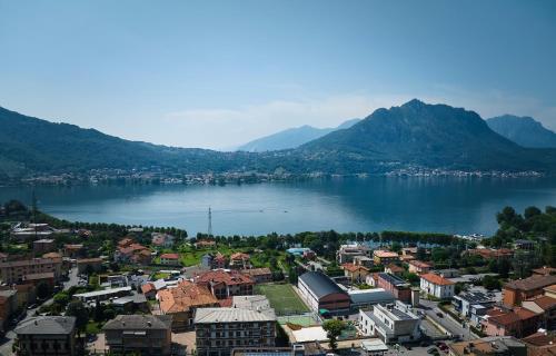 an aerial view of a city and a body of water at casa mileti in Vercurago