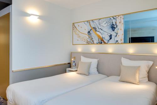 Brit Hotel Orléans St Jean de Braye - L'Antarèsにあるベッド