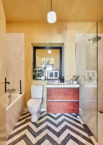 a bathroom with a toilet and a sink and a shower at Pirate House Sea front Private Pool Garden Funchal in Funchal