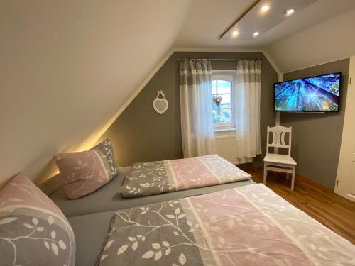 Postel nebo postele na pokoji v ubytování Ferienhaus -Möwennest-