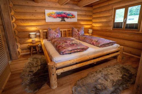 Ένα ή περισσότερα κρεβάτια σε δωμάτιο στο Chalet Arberschlössl