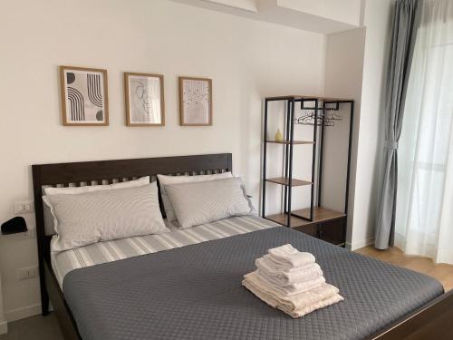 Ένα ή περισσότερα κρεβάτια σε δωμάτιο στο Magie Milano