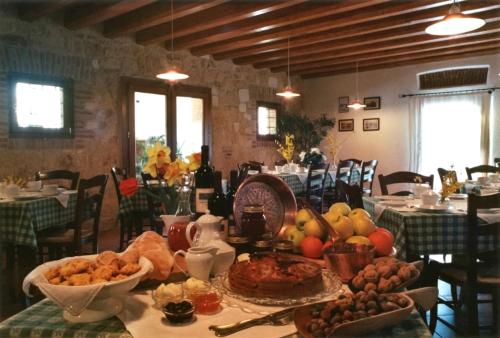 a table with food on it in a restaurant at Fattoria Grimana in Montegalda