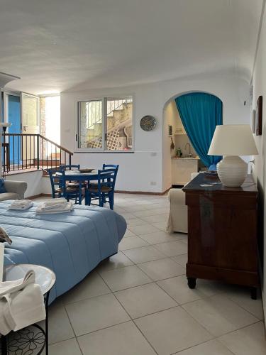 a living room with a bed and a table at Casa Rosetta in Anacapri