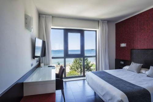 Postel nebo postele na pokoji v ubytování Hotel Alda Carril