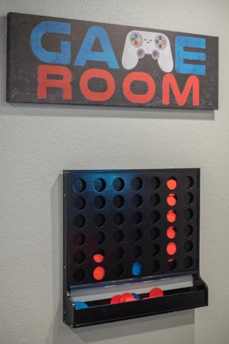 a game room with a nintendo wii game board at Pool, Gameroom & Minigolf Enchanting Texas Home in San Antonio