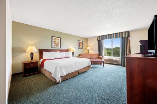 a hotel room with a bed and a television at Best Western Annawan Inn in Annawan