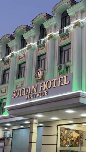 a building with a sign that reads southern hotel at Sultan hotel boutique in Andizhan