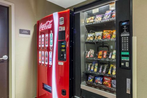 a coca cola vending machine next to a refrigerator at Sleep Inn & Suites in Pleasanton