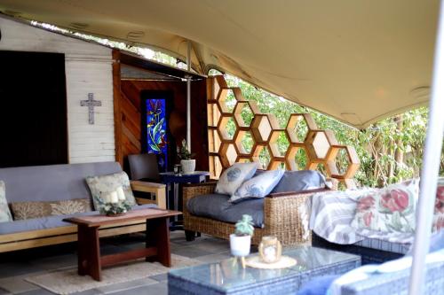 a living room with a couch and a table at House of Perez in Wellington