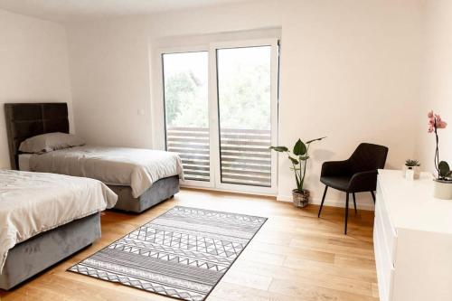 Ένα ή περισσότερα κρεβάτια σε δωμάτιο στο Aura Apartments