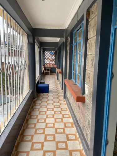 a corridor of a building with windows and a floor at Future Stars Centre Kibera in Nairobi